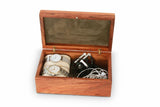 Image of 2 watches on pillows and electronics in a GP Box