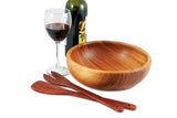 Image of Red Hardwood Salad Servers next to a wooden bowl