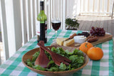 Red Hardwood Salad Hands in a salad bowl on a table