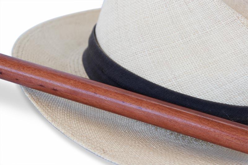 White hat with a Redgum Knob Handle Walking Stick image