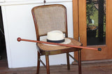 Image of a Redgum Knob Handle Walking Stick on a chair