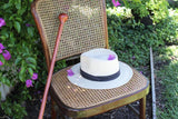 Image of a Redgum Knob Handle Walking Stick on a chair