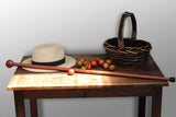 Photo of a Redgum Knob Handle Walking Stick on a table