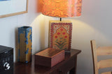 Picture of a Tamar GP Box - Tiger Myrtle on a table with lamp
